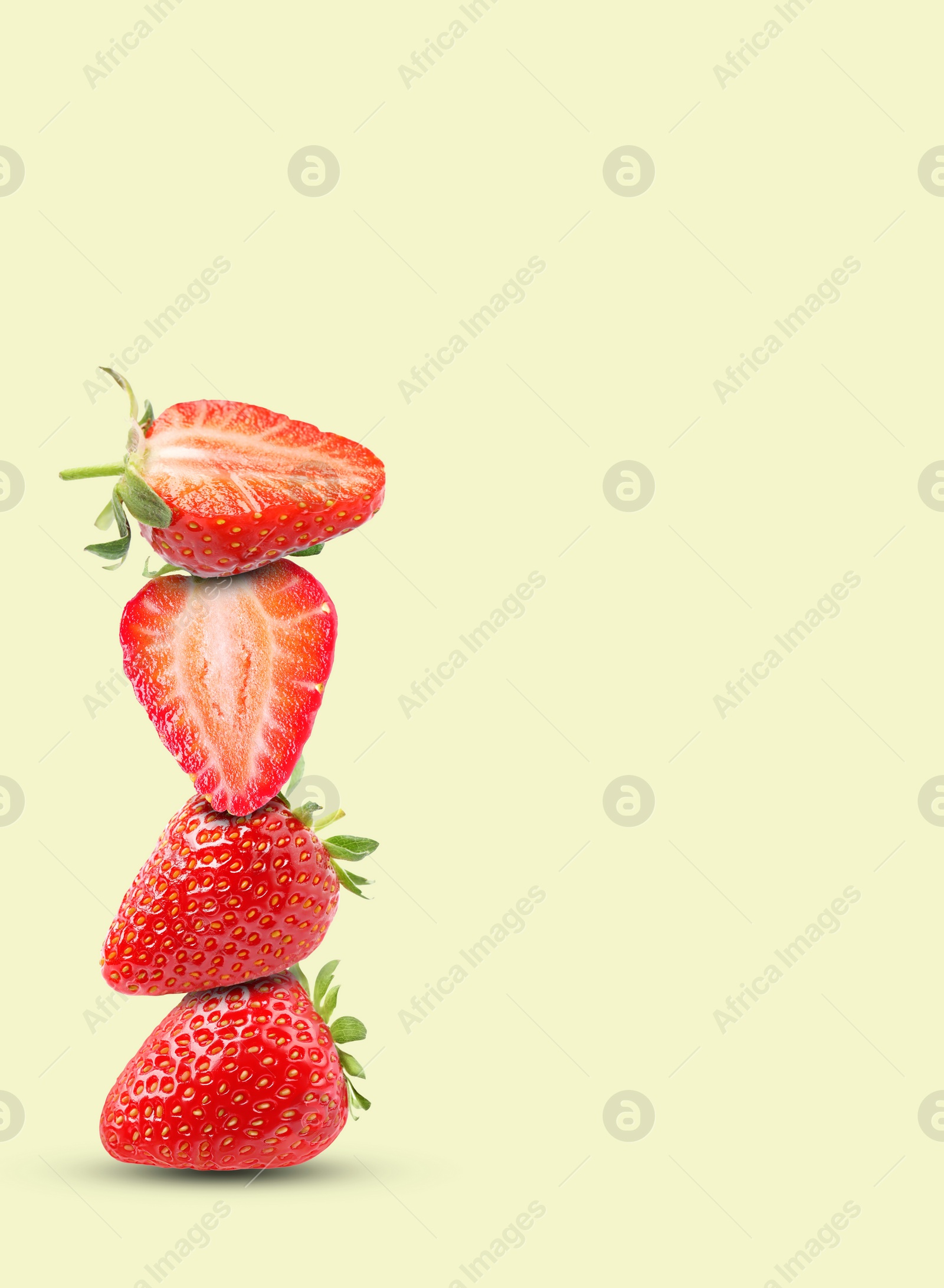 Image of Stack of fresh strawberries on beige background, space for text