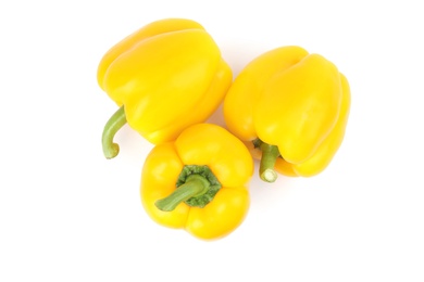 Ripe yellow bell peppers isolated on white, top view