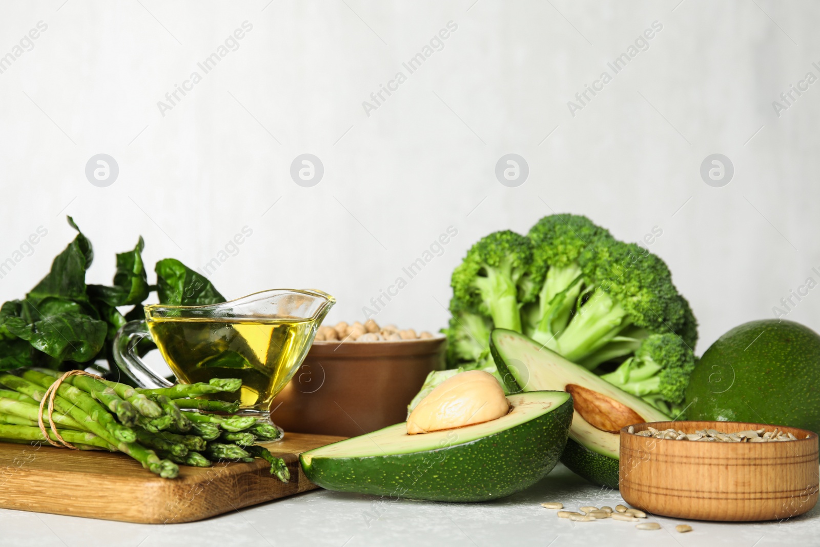 Photo of Different products rich in vitamin E on white table