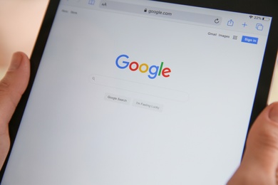 MYKOLAIV, UKRAINE - OCTOBER 31, 2020: Woman using Google search engine on tablet, closeup