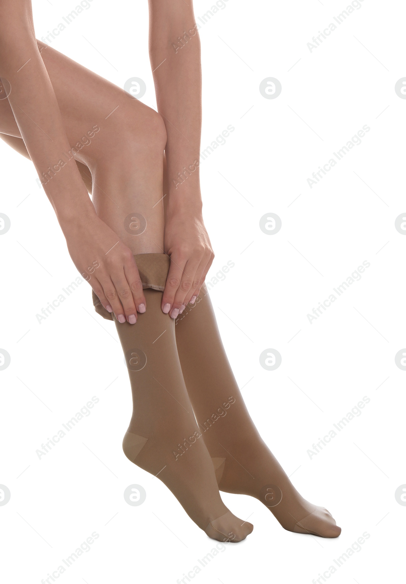 Photo of Woman wearing compression tights on white background, closeup