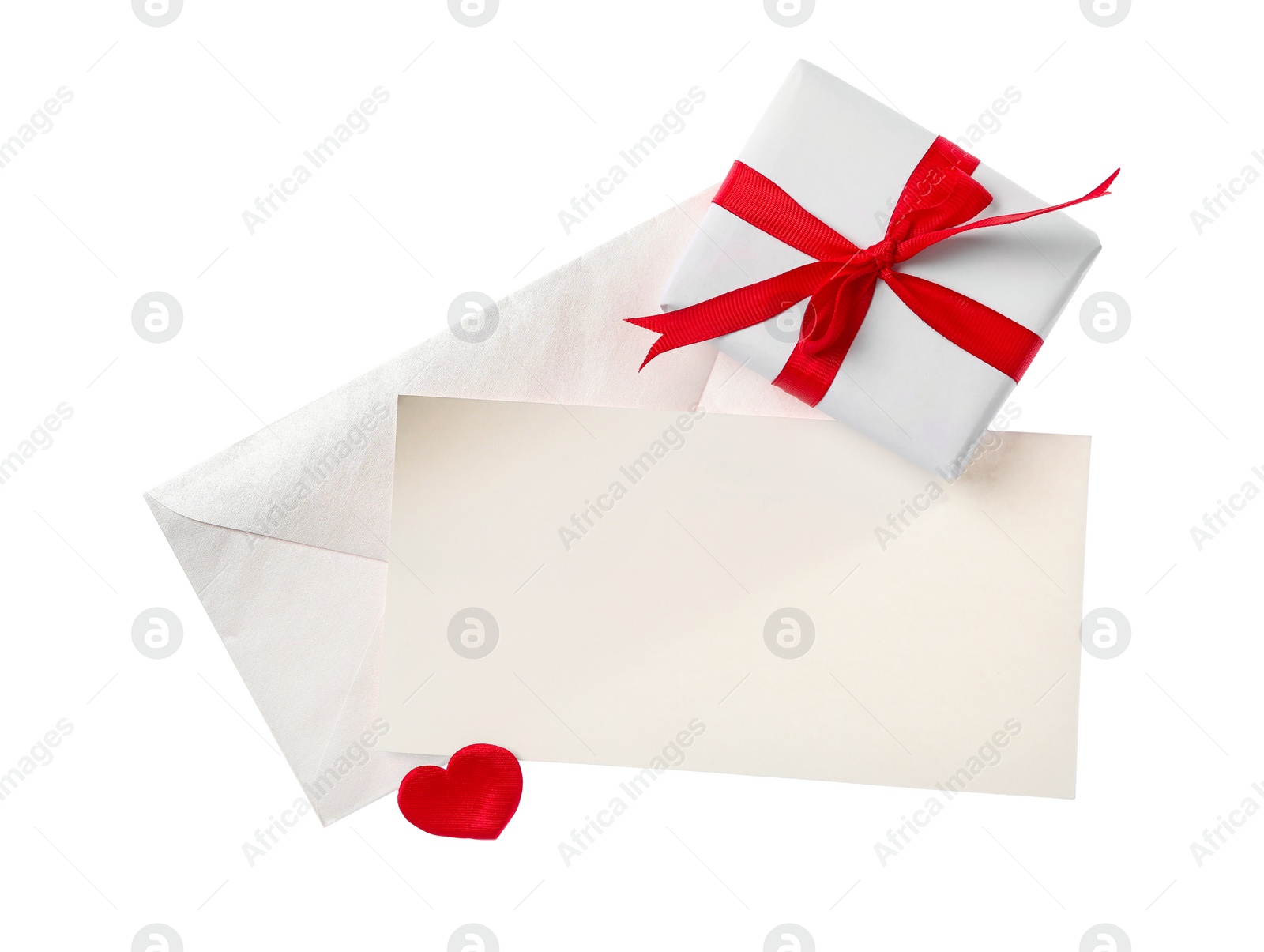 Photo of Blank card and gift box on white background, top view. Valentine's Day celebration