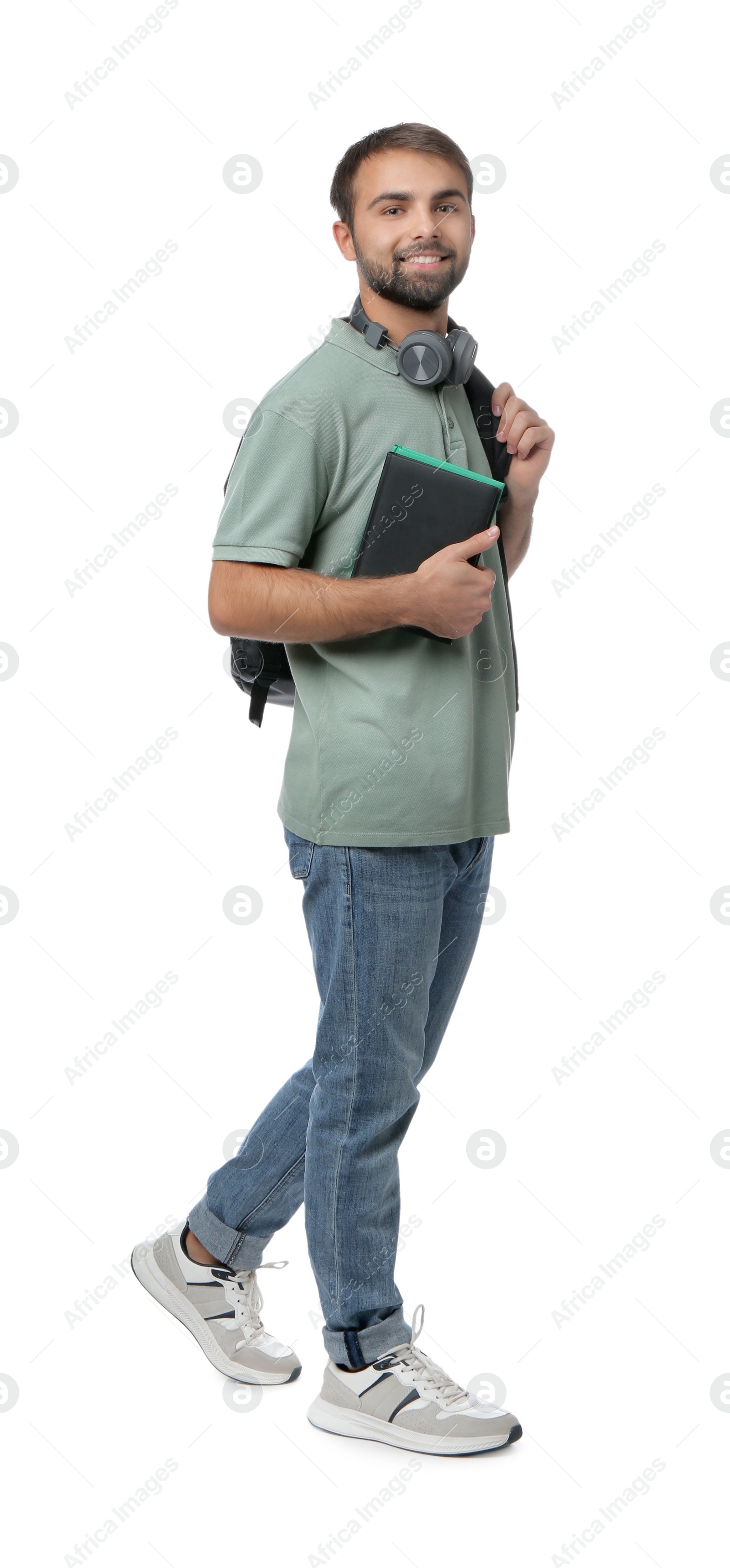 Photo of Student with headphones, backpack and books on white background