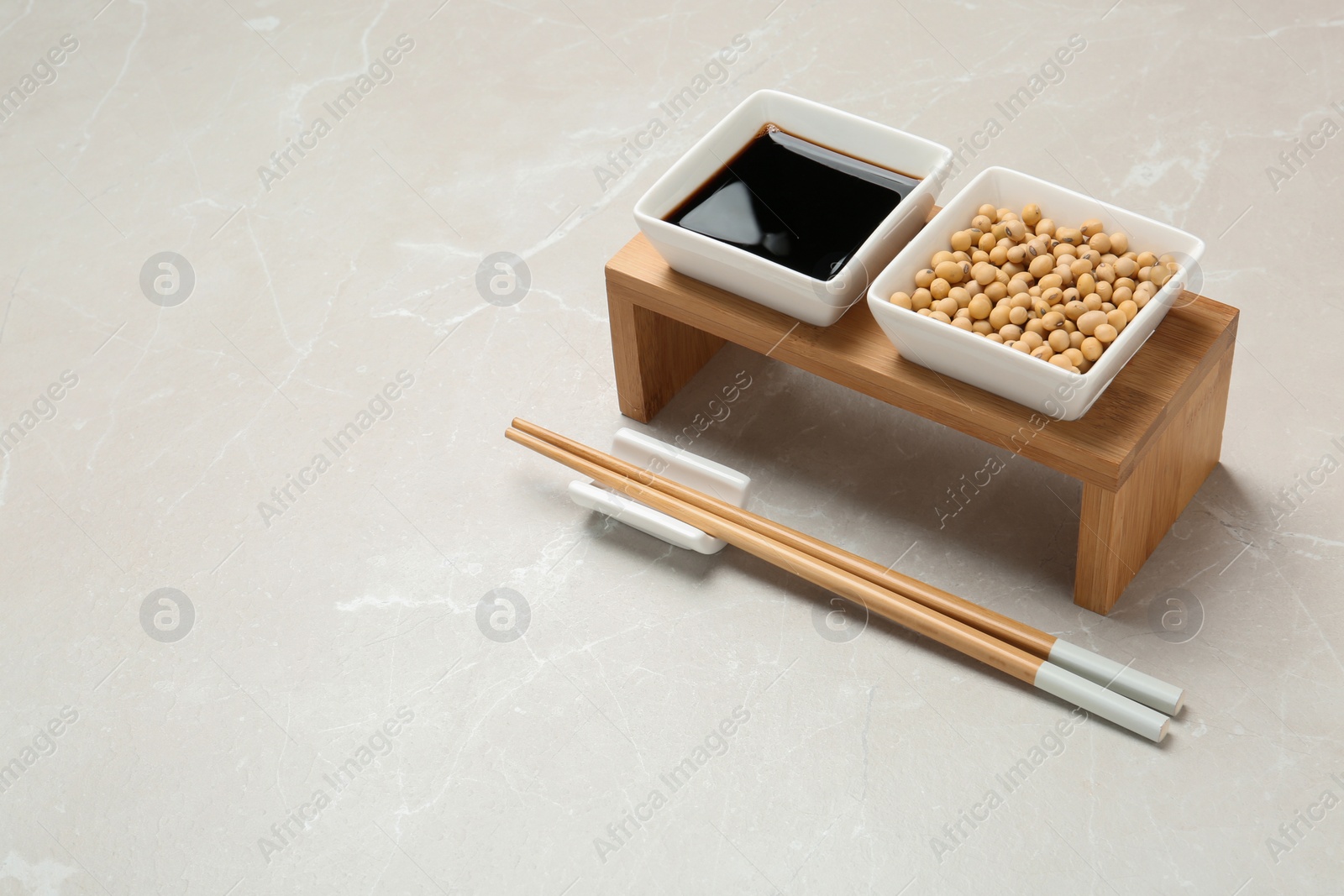 Photo of Dish of soy sauce served on table. Space for text