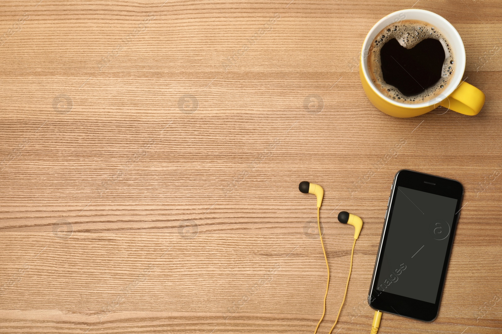 Photo of Flat lay composition with headphones, smartphone, cup of coffee and space for text on wooden background