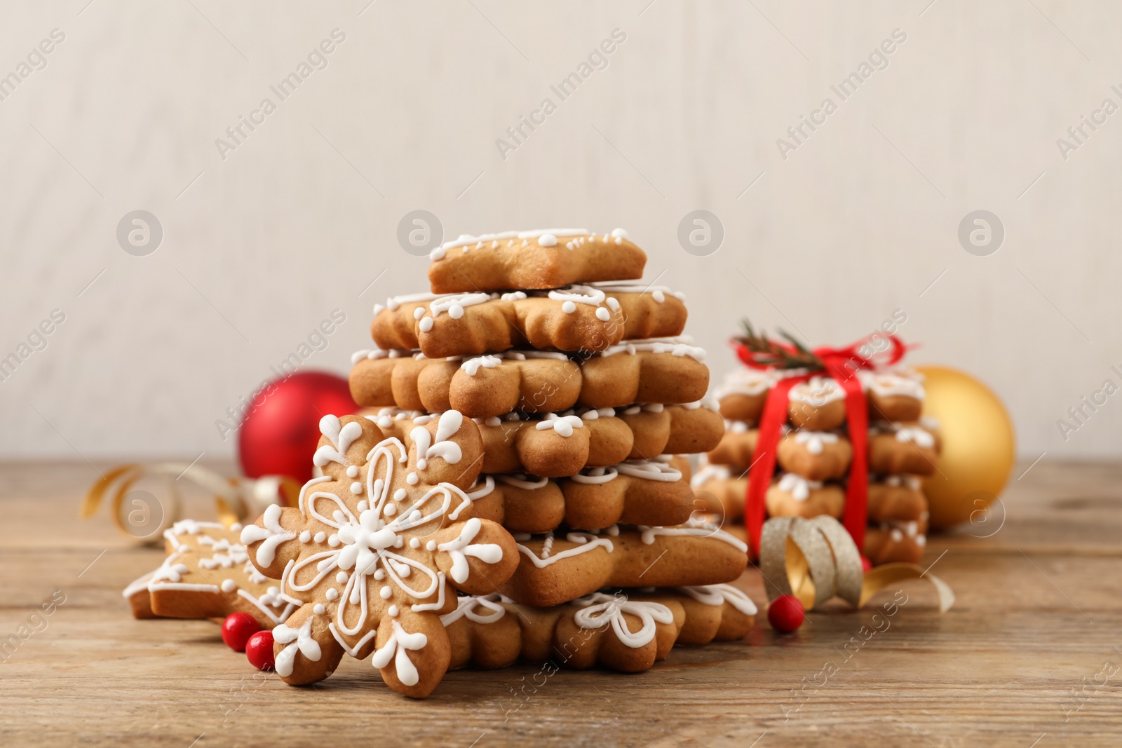 Photo of Stack of tasty Christmas cookies on wooden table