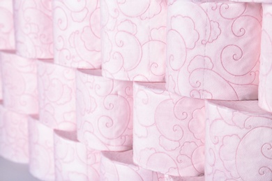 Photo of Many rolls of toilet paper as background. Personal hygiene