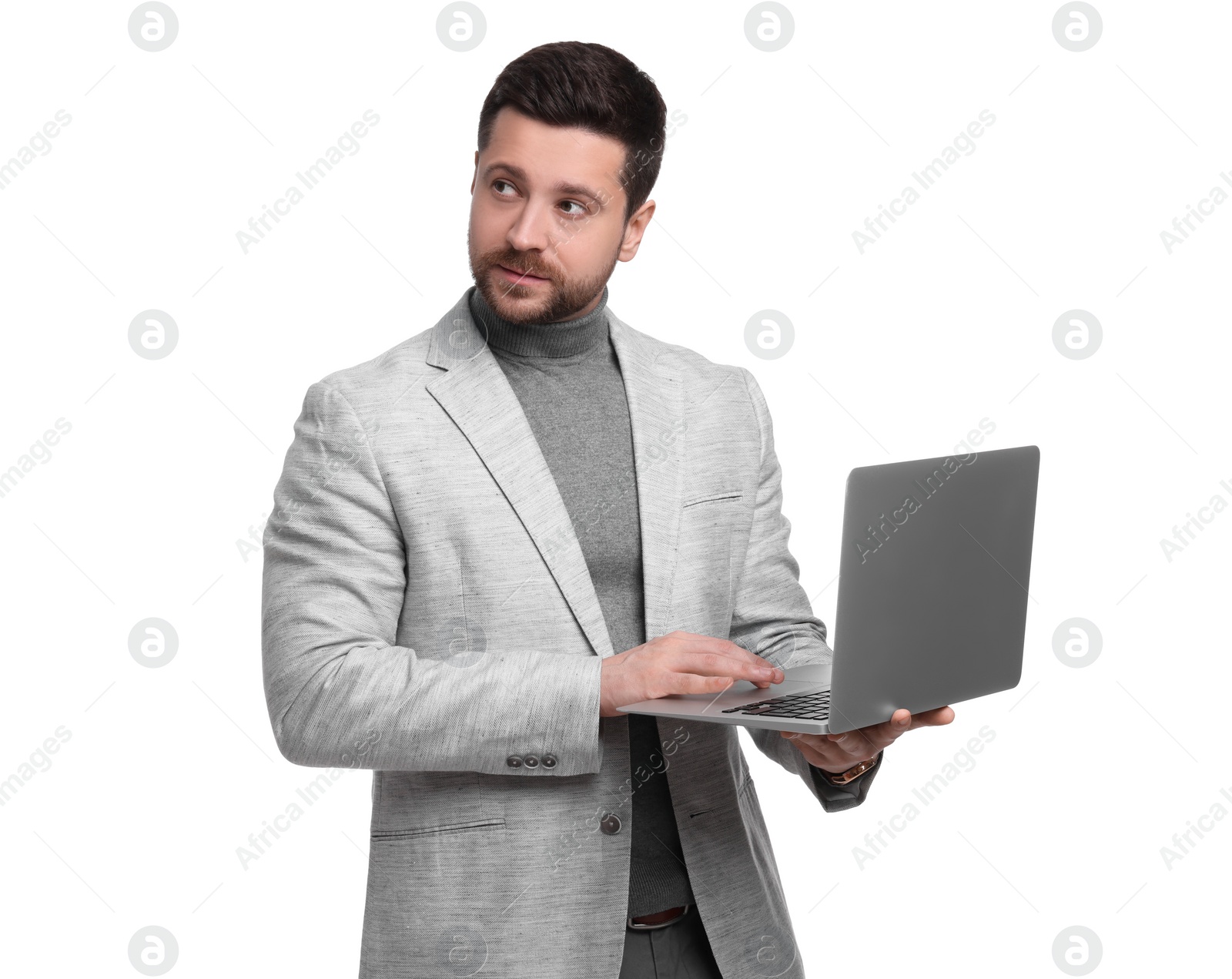 Photo of Handsome bearded businessman using laptop on white background