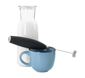 Milk frother wand, cup and glass carafe isolated on white