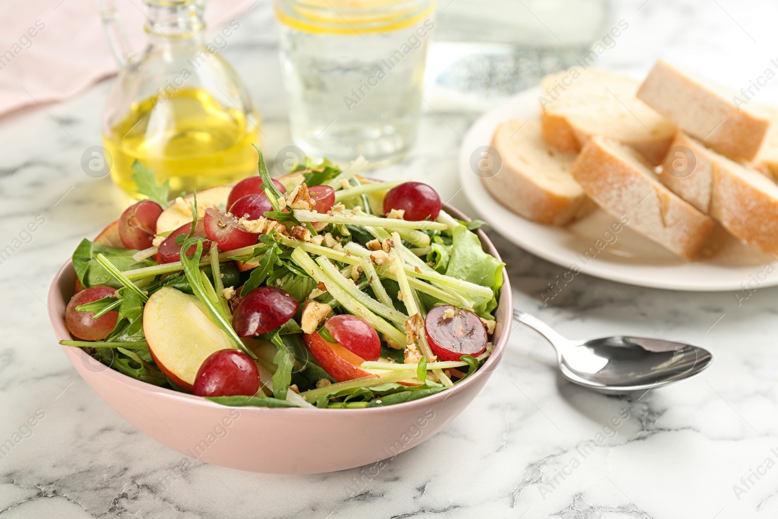 Photo of Delicious fresh celery salad on white marble table