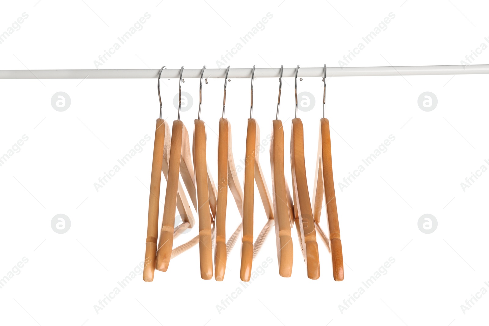 Photo of Wardrobe rack with wooden hangers isolated on white