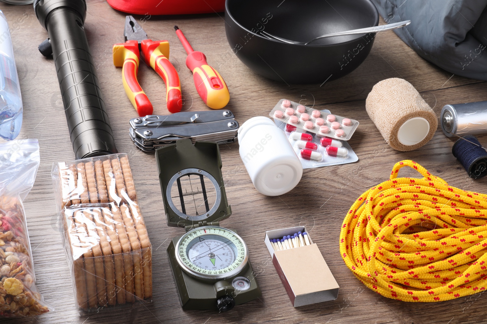 Photo of Disaster supply kit for earthquake on wooden table