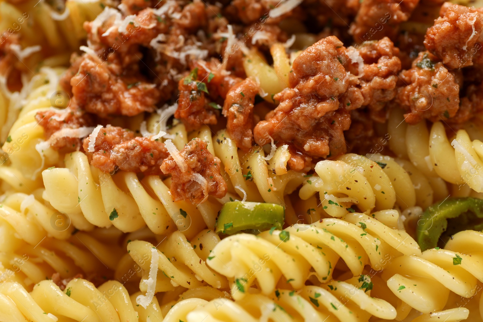 Photo of Delicious pasta with minced meat as background, closeup