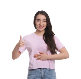 Photo of Happy healthy woman touching her belly on white background