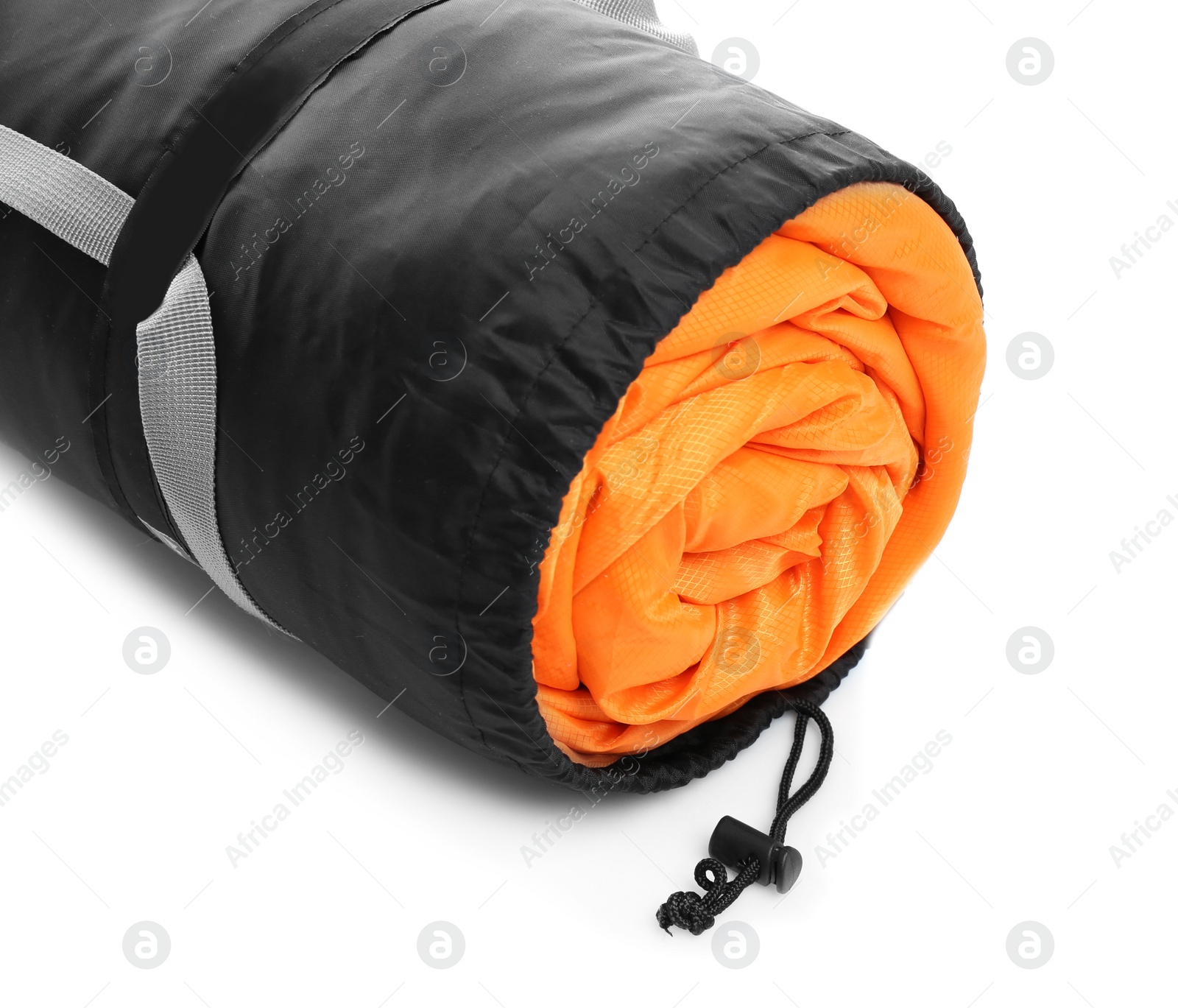 Photo of Sleeping bag in case on white background. Camping equipment