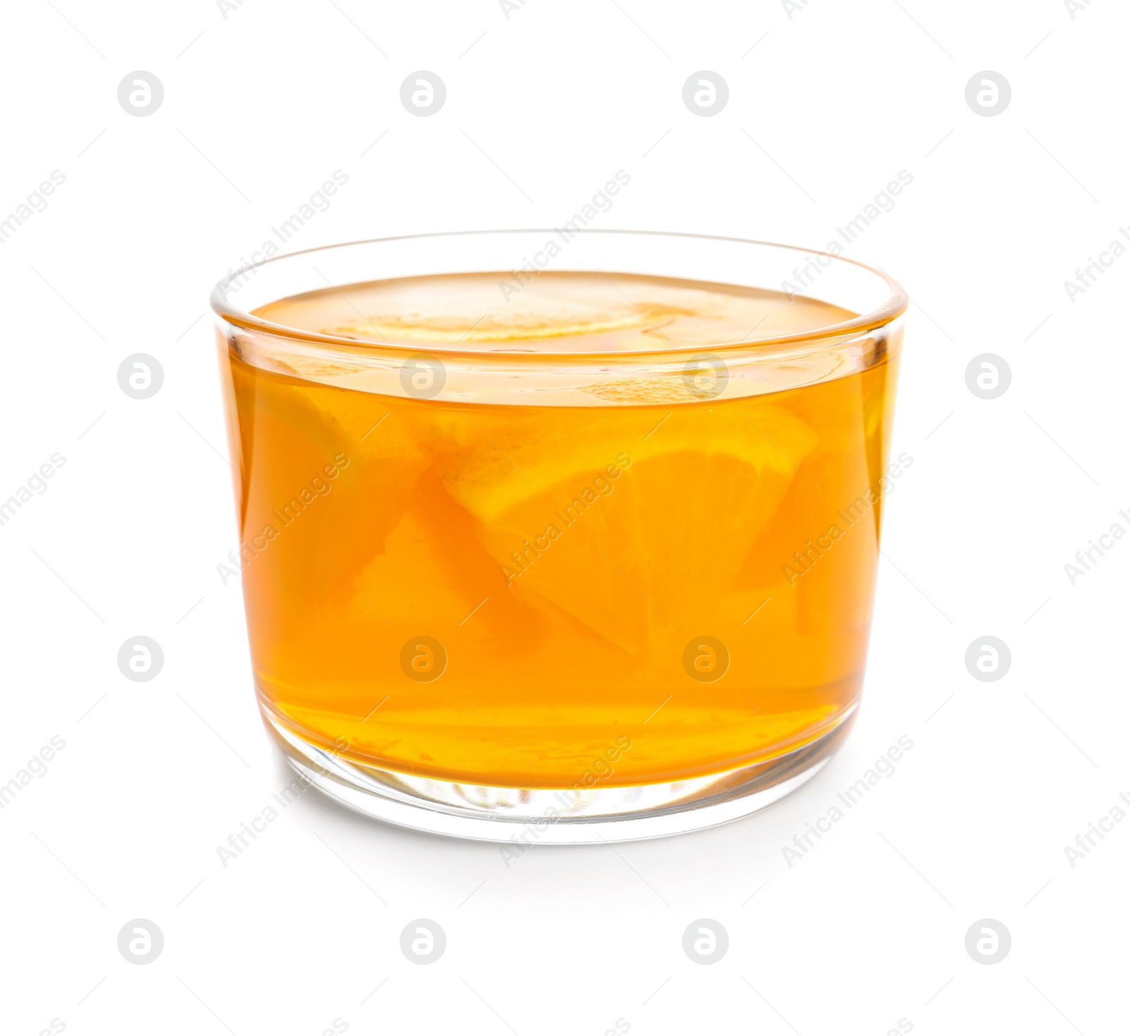 Photo of Tasty jelly dessert with slices of orange in glass on white background