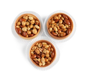 Photo of Tartlets with caramelized nuts isolated on white, top view. Tasty dessert