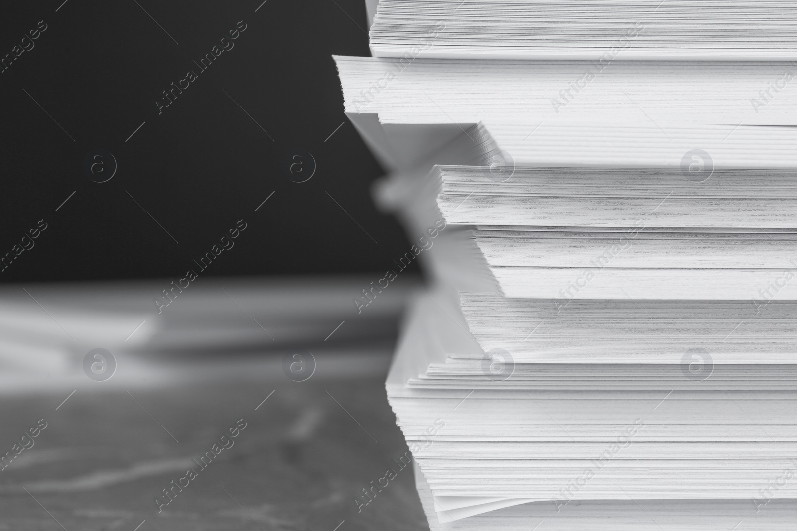 Photo of Stack of blank white paper on table, closeup. Space for text