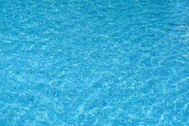 Photo of Clear refreshing water in swimming pool on sunny day, closeup