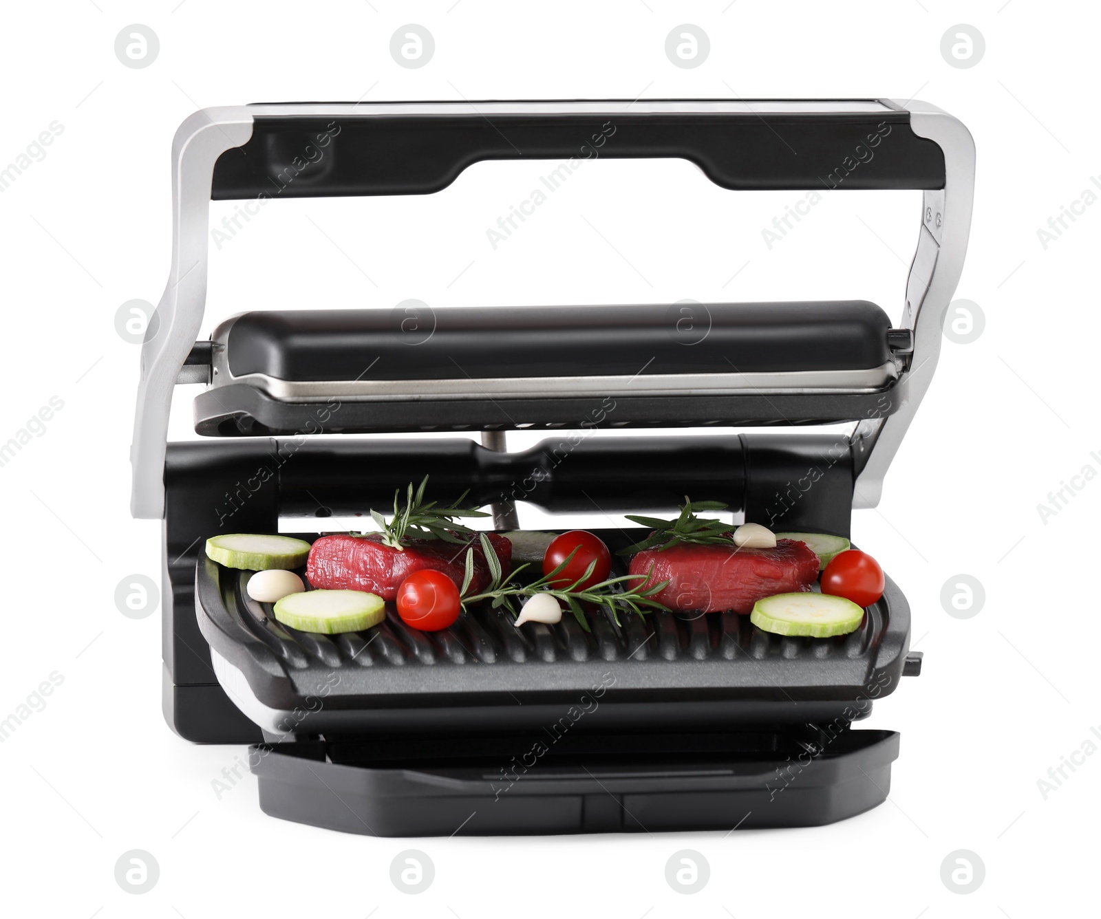 Photo of Electric grill with raw meat, rosemary and vegetables isolated on white