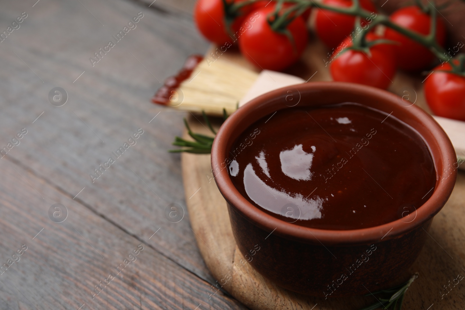 Photo of Marinade in bowl on wooden table, closeup. Space for text