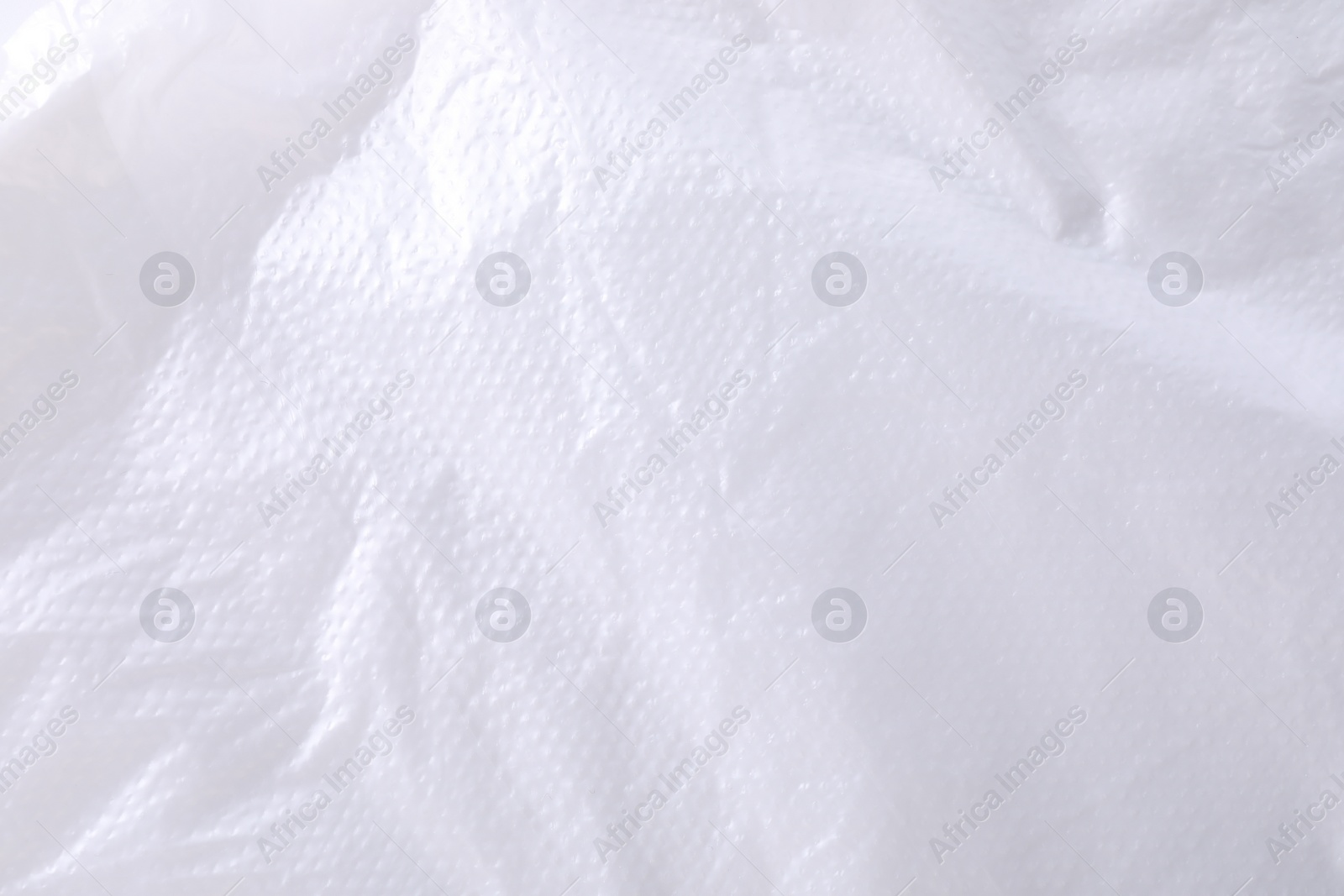 Photo of Texture of white plastic bag as background, closeup