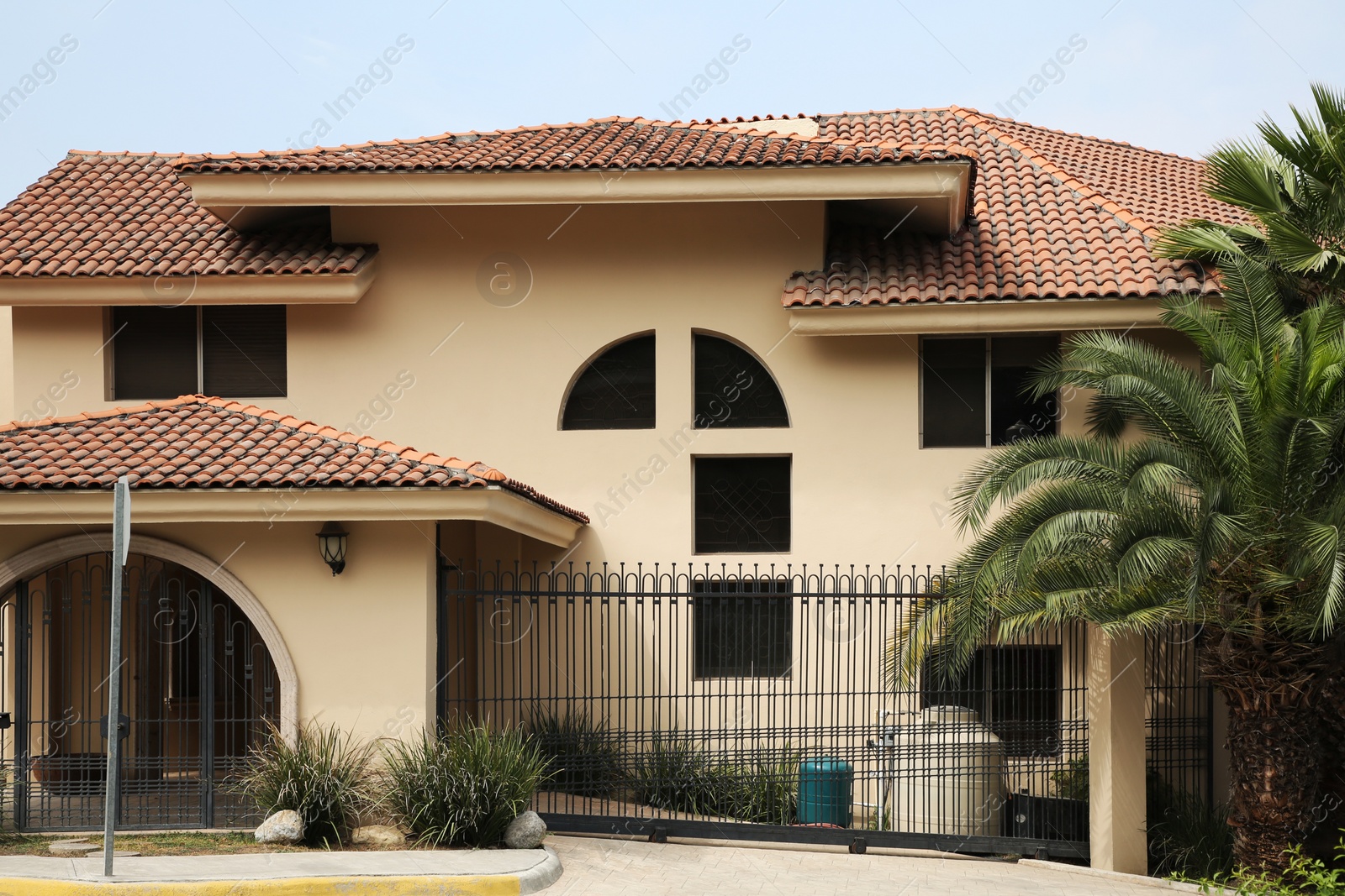 Photo of Stylish estate with grey metal gates on street