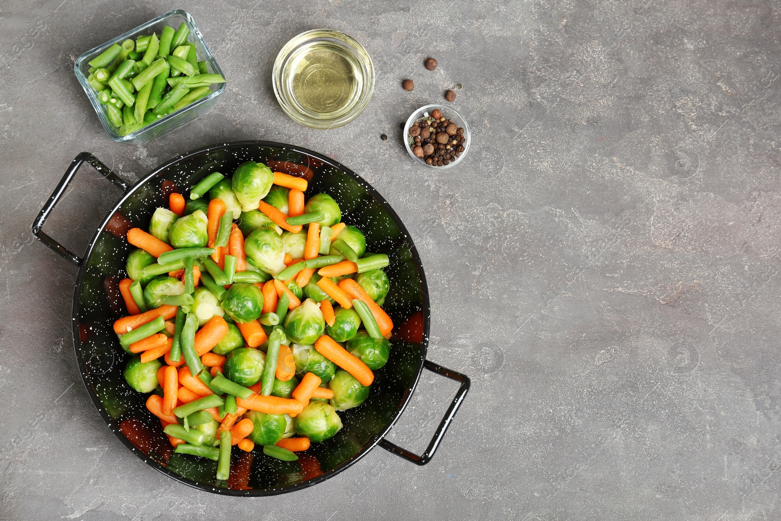 Photo of Flat lay composition with frozen vegetables on grey background