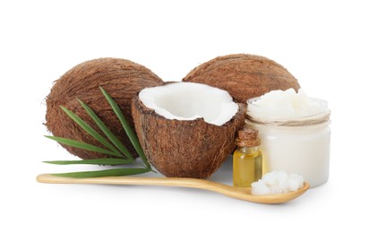 Organic coconut cooking oil, fresh fruits, wooden spoon and green leaf isolated on white