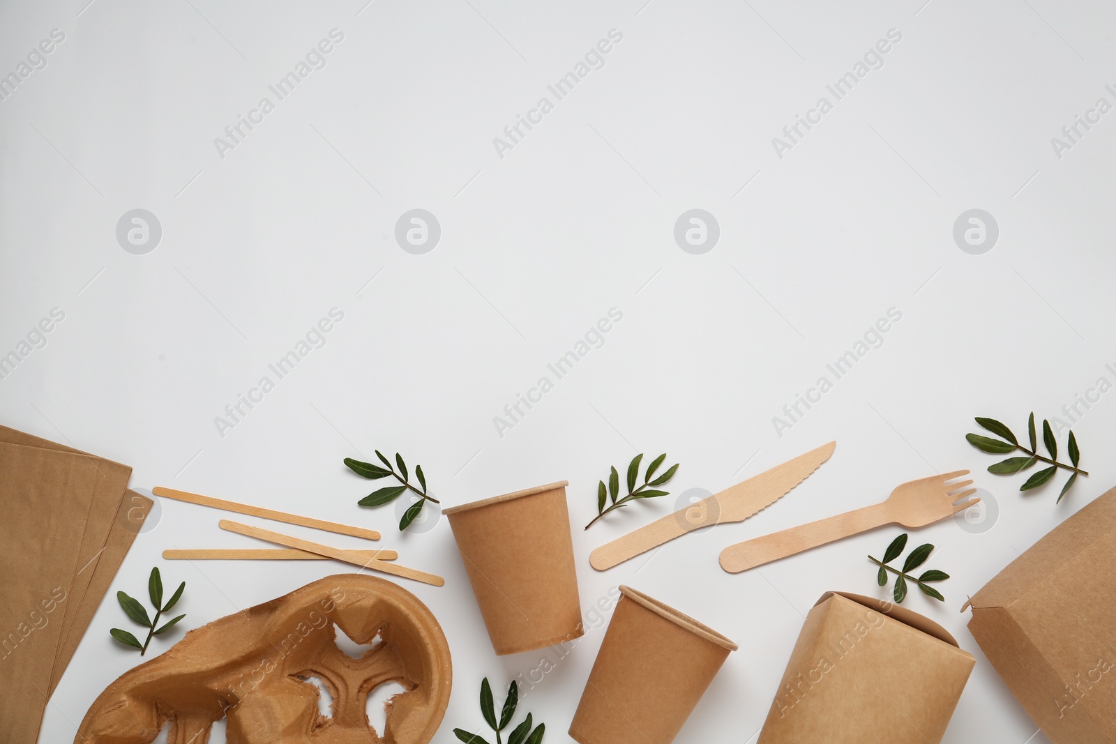 Photo of Flat lay with eco friendly products on light background, space for text