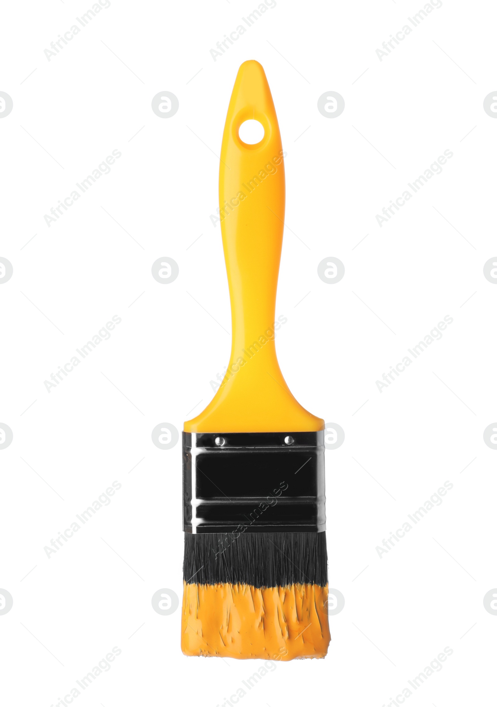 Photo of Brush with yellow paint on white background