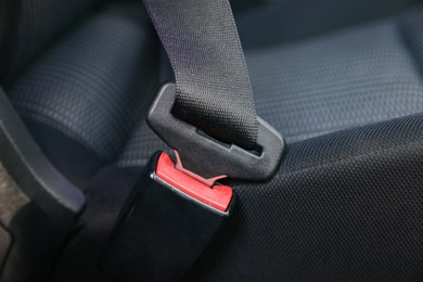 Photo of Fastened safety belt on driver's seat in car