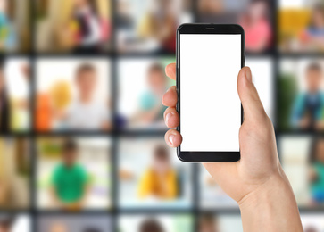 Image of Distance education. Teacher using phone for online lesson during quarantine and lockdown due coronavirus pandemic, closeup