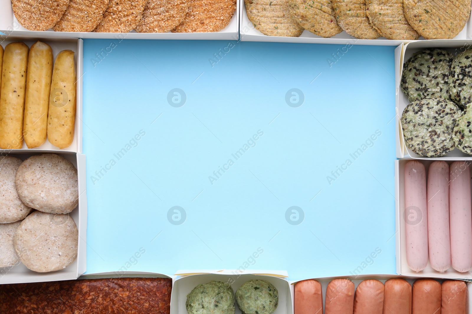 Photo of Many different raw vegan meat products on light blue background, flat lay. Space for text