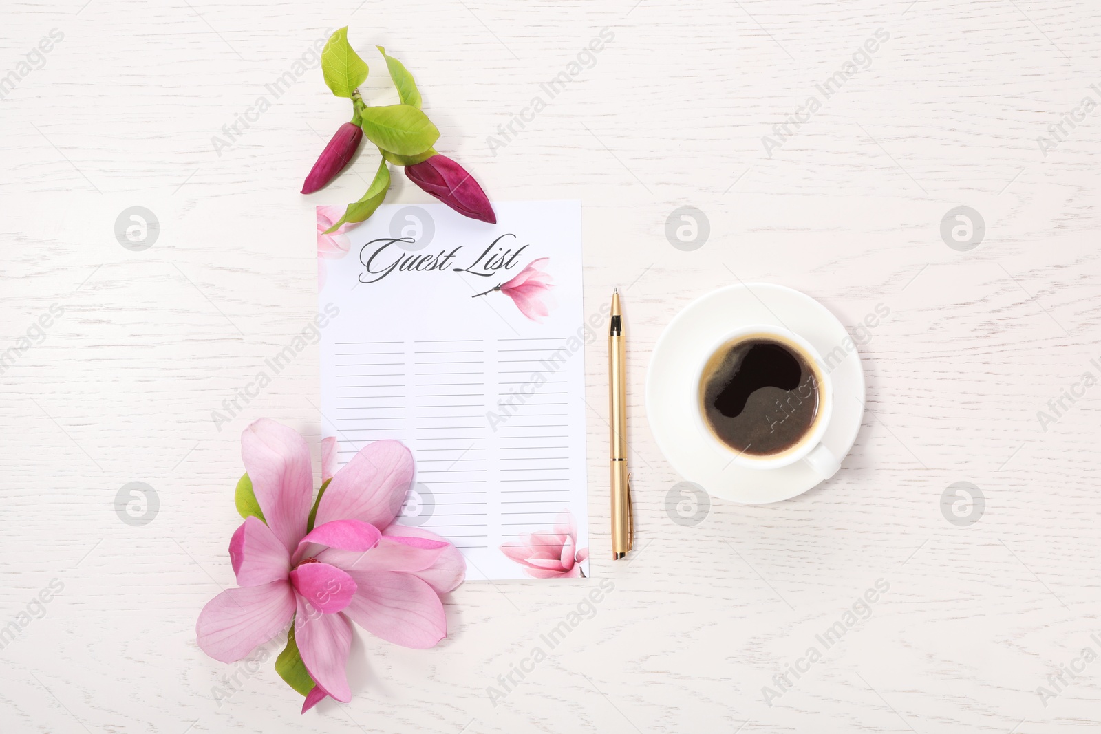 Photo of Guest list, coffee, pen and beautiful flowers on white wooden table, flat lay. Space for text