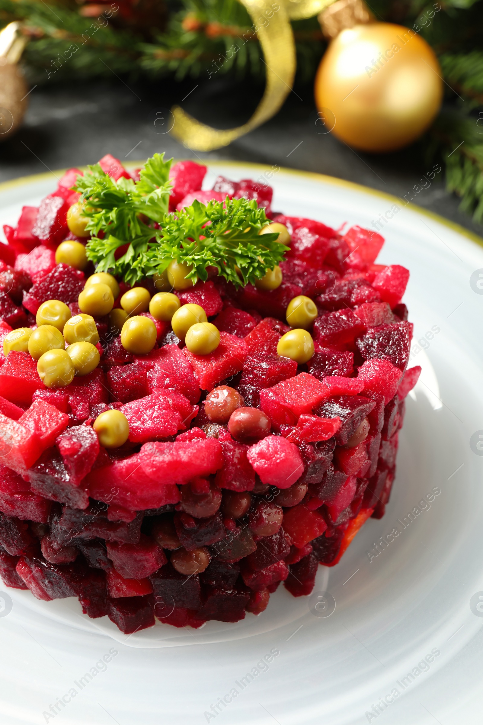 Photo of Traditional Russian salad vinaigrette on plate, closeup