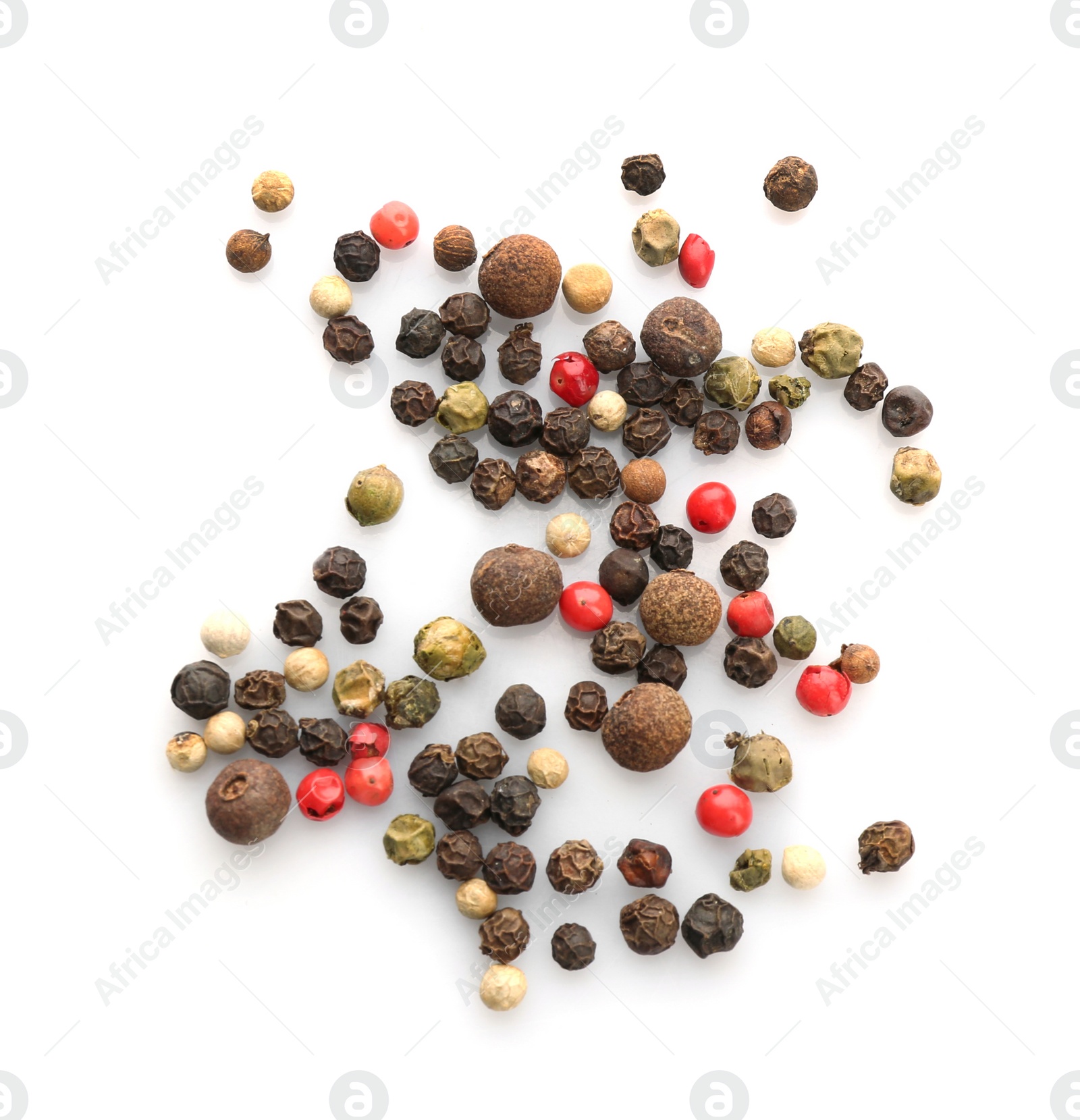 Photo of Mix of different pepper grains on white background, top view. Natural spice