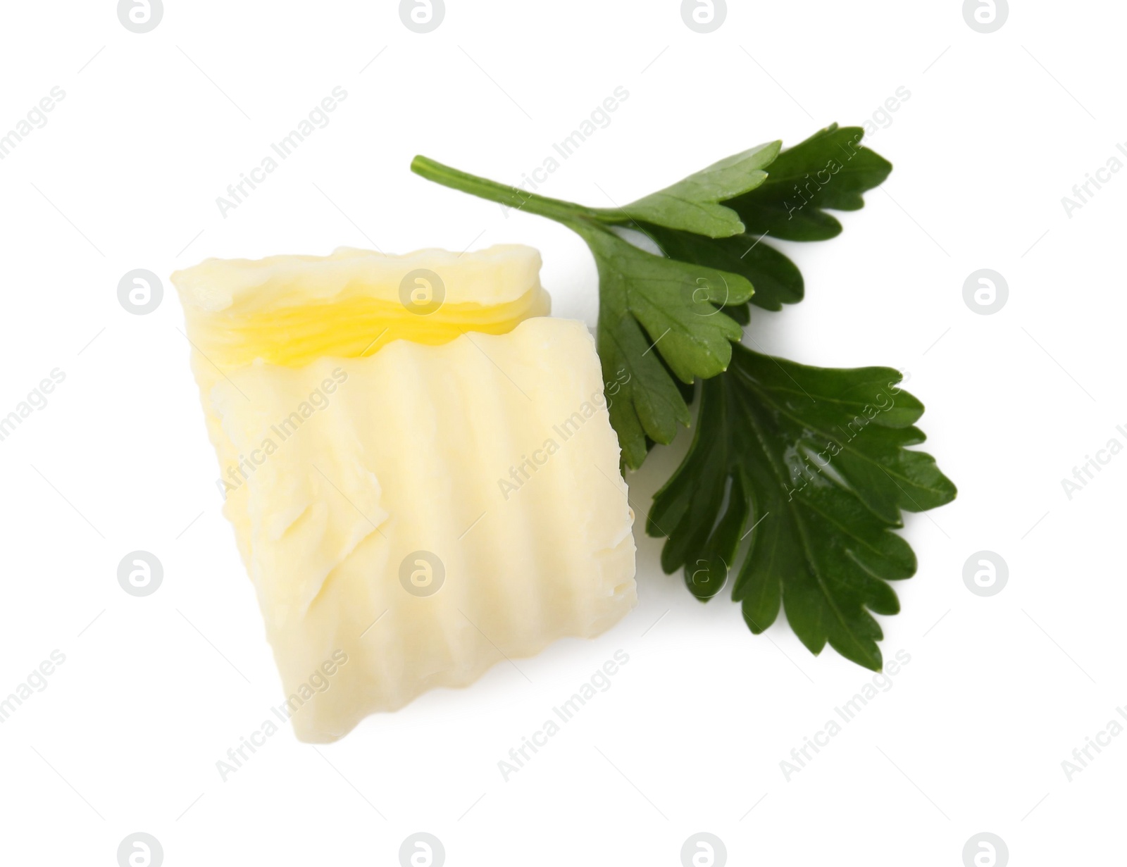 Photo of Tasty butter curl and fresh parsley isolated on white, top view