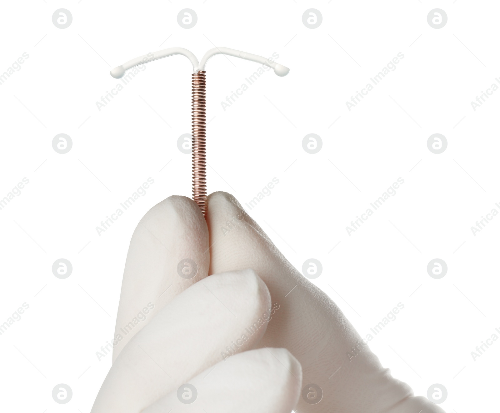 Photo of Gynecologist holding copper intrauterine contraceptive device on white background, closeup