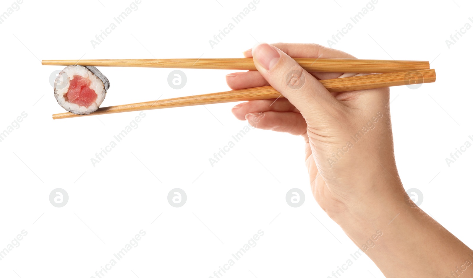 Photo of Woman holding sushi roll on white background, closeup