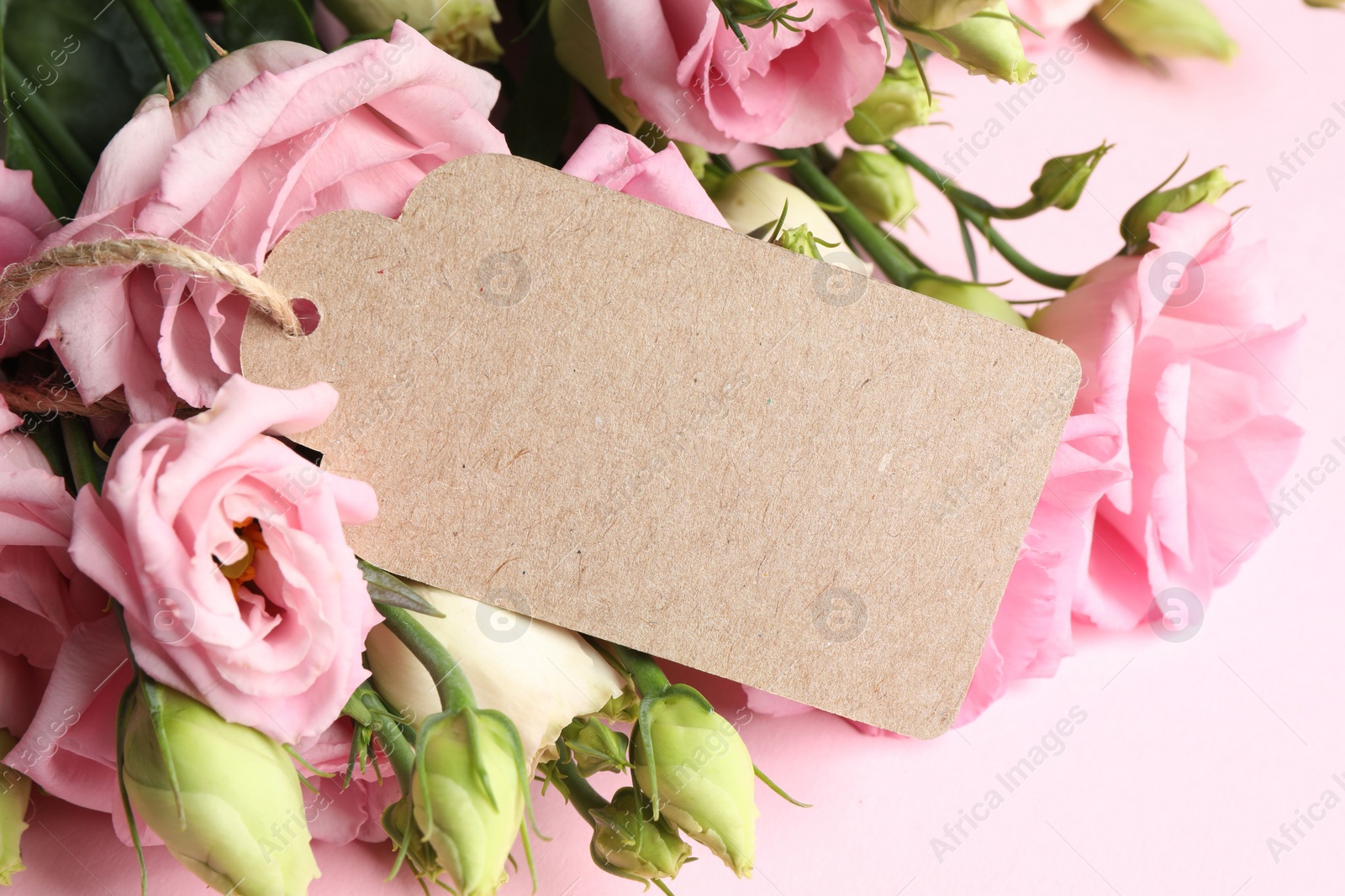 Photo of Happy Mother's Day. Beautiful flowers and blank card on pink background, closeup