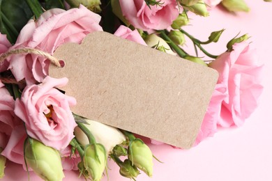 Happy Mother's Day. Beautiful flowers and blank card on pink background, closeup