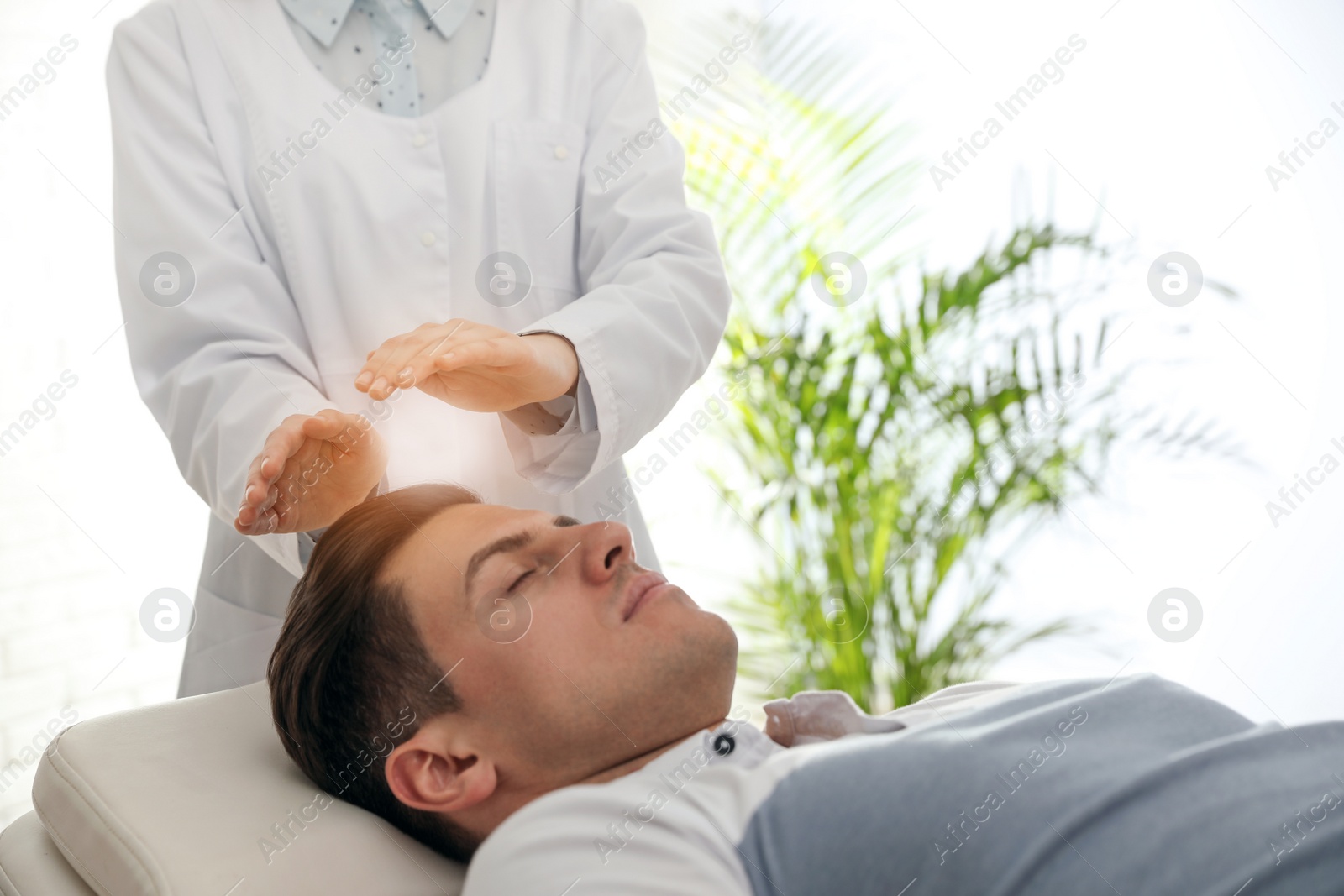 Photo of Psychotherapist and patient in office. Hypnotherapy session