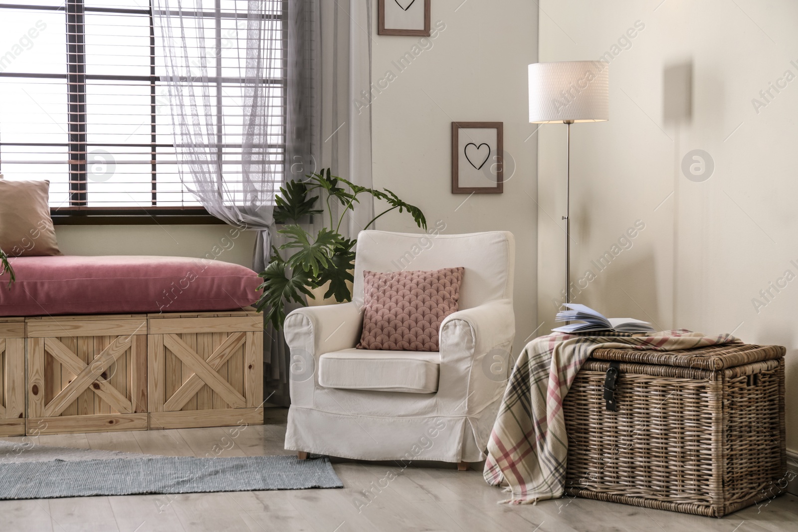 Photo of Elegant living room interior with comfortable armchair near window