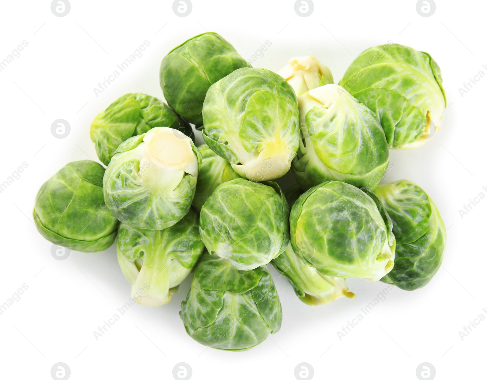 Photo of Pile of fresh Brussels sprouts isolated on white, top view