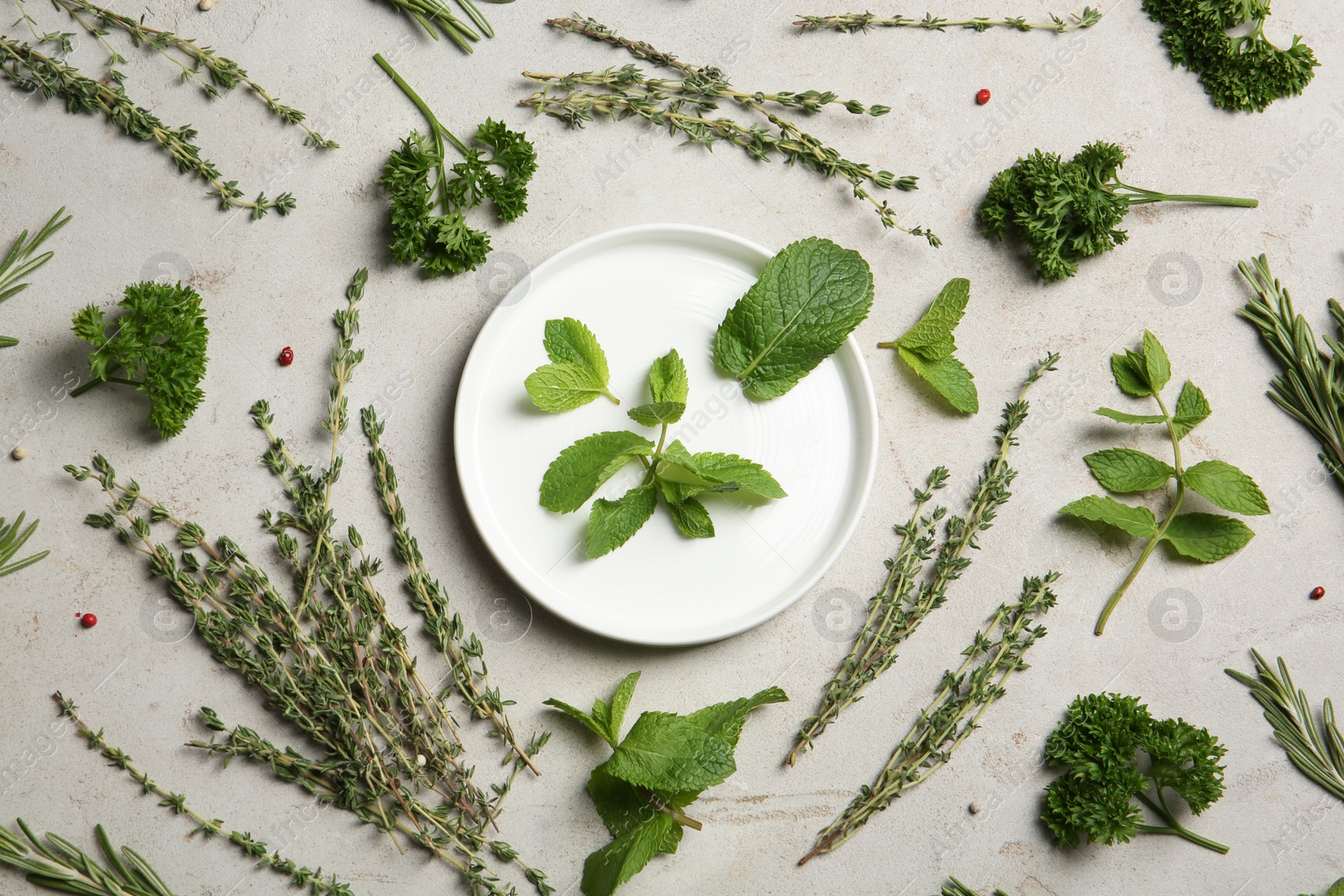 Photo of Flat lay composition with aromatic herbs on table