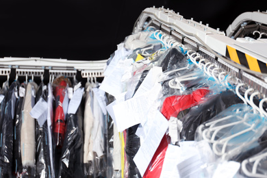 Photo of Hangers with clothes on garment conveyor at dry-cleaner's