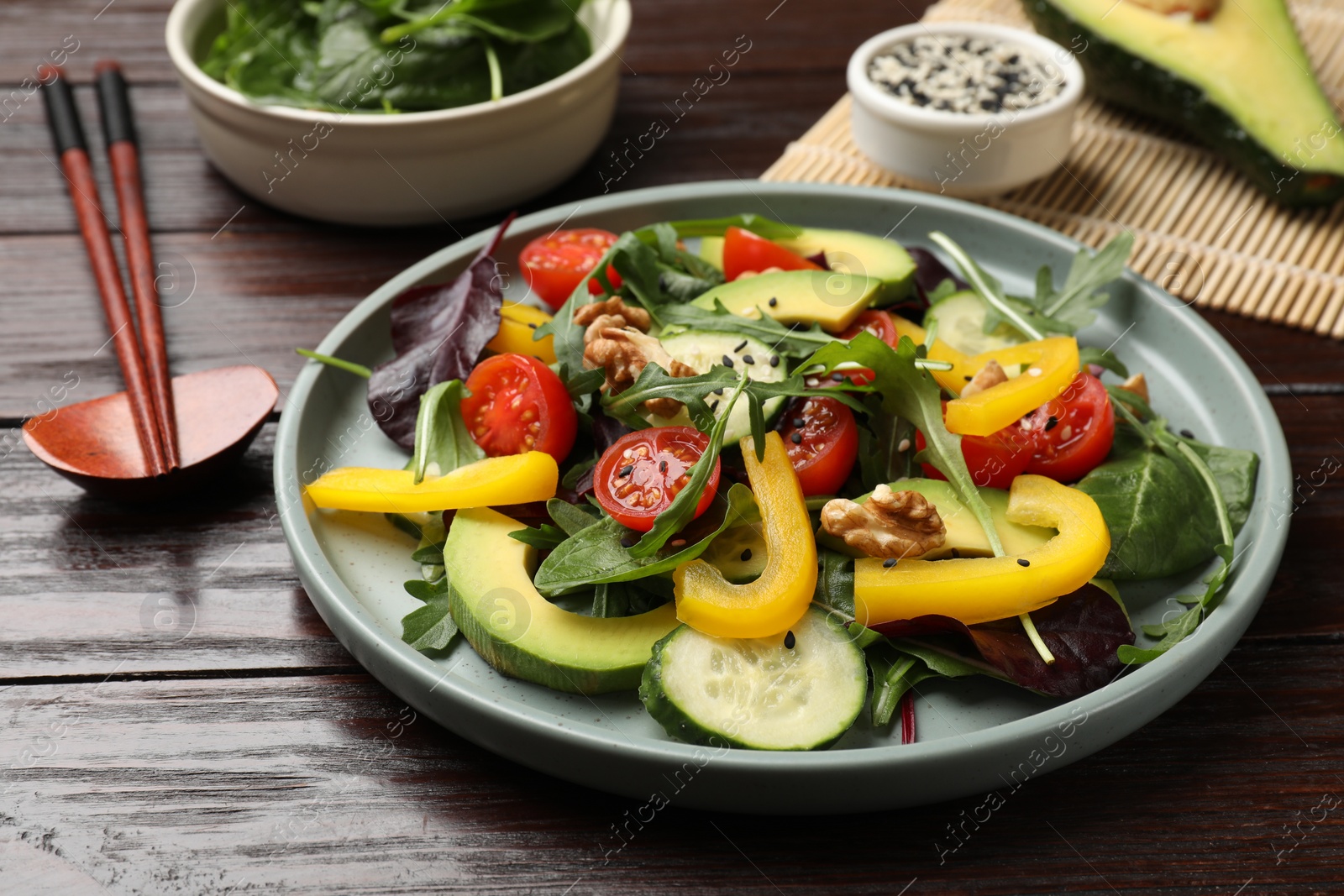 Photo of Balanced diet and vegetarian foods. Plate with different delicious products on wooden table