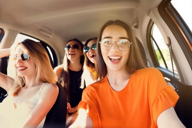Photo of Happy beautiful young women together in car