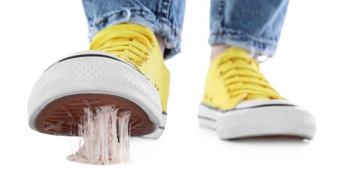 Photo of Person stepping into chewing gum on white background, closeup